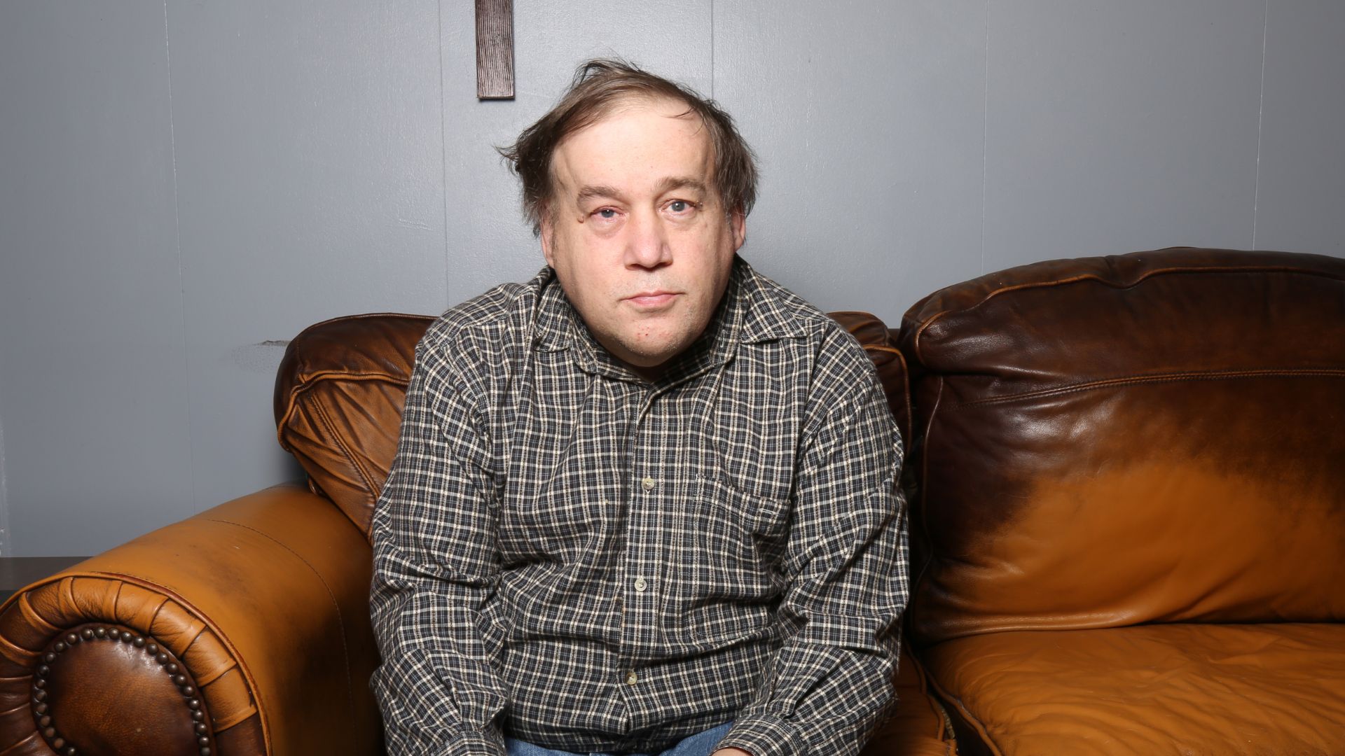 Two Helpers Picking up Disabled Senior Woman for Transport