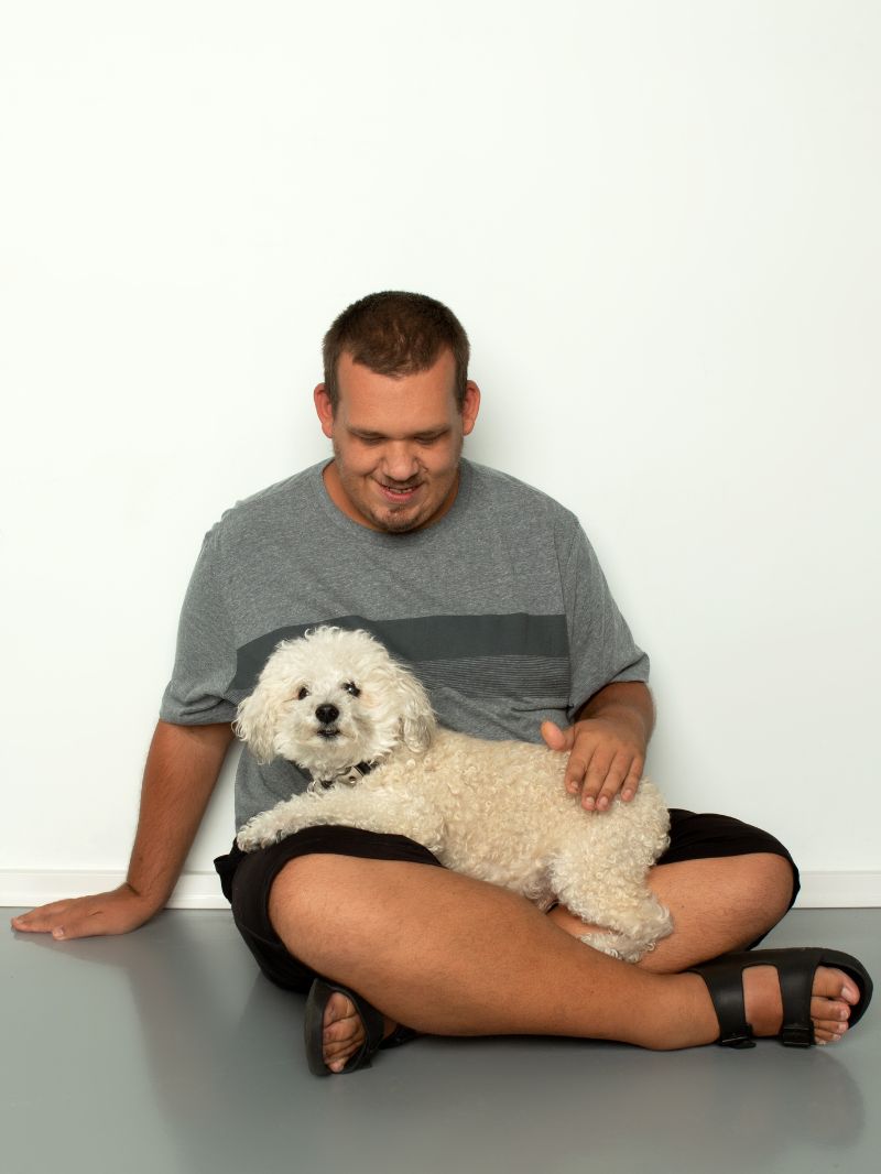 Autistic man with pet Disabled Woman Using a Laptop