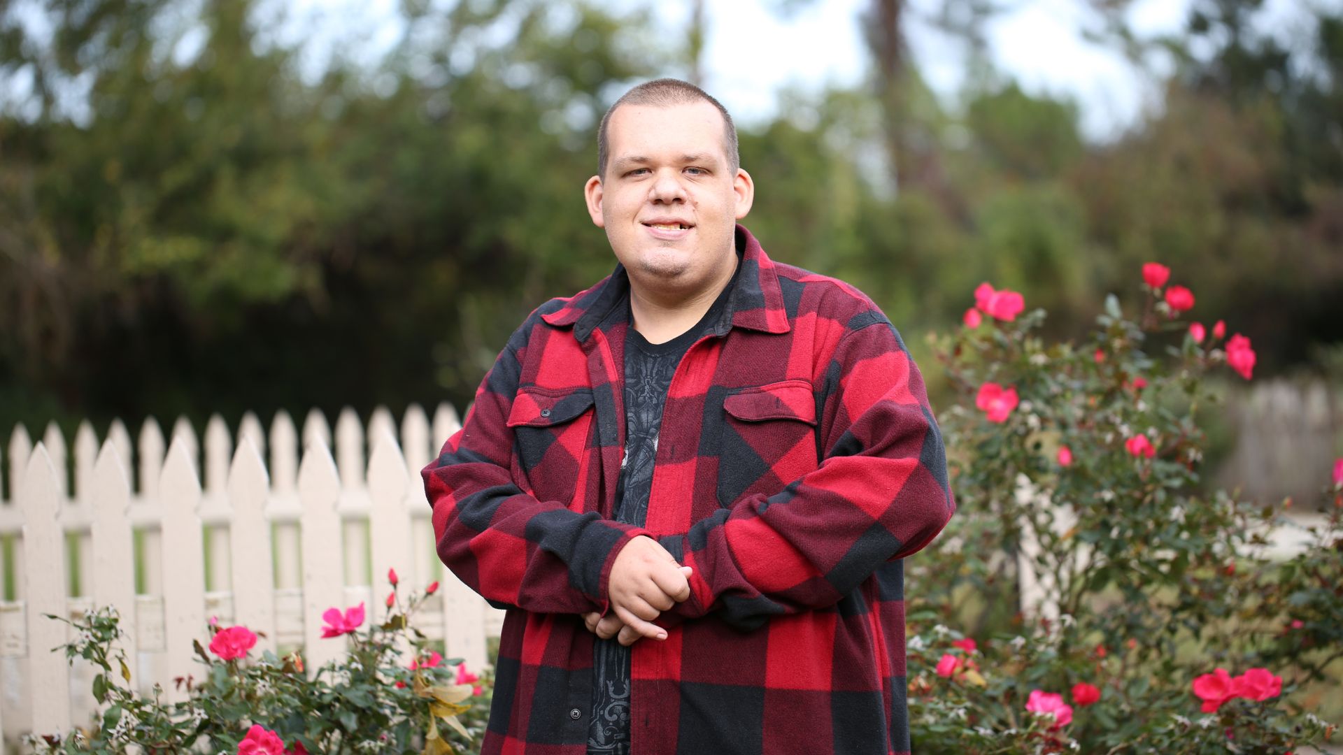 Disabled Man Two Helpers Picking up Disabled Senior Woman for Transport