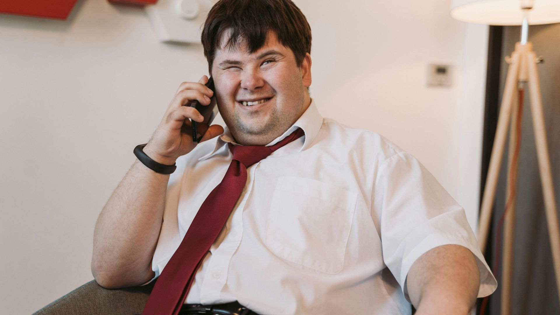 Man with Disability on a call Disabled Woman Using a Laptop