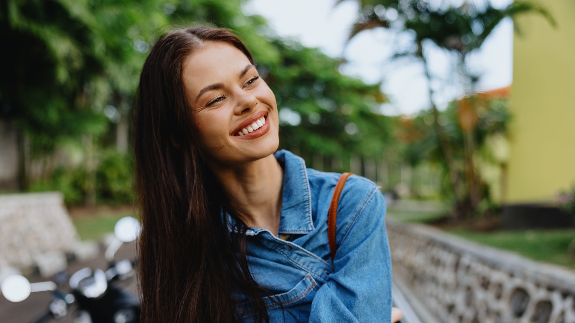 Woman Brunette Smile with Teeth Walking outside Two Helpers Picking up Disabled Senior Woman for Transport
