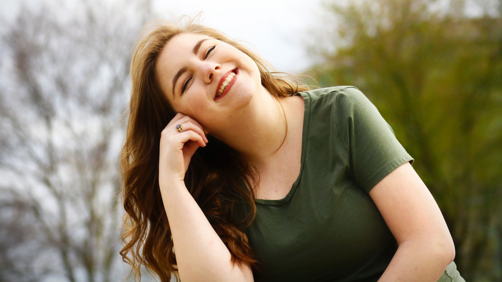 Woman in Green Shirt Smiling A group of disabled people